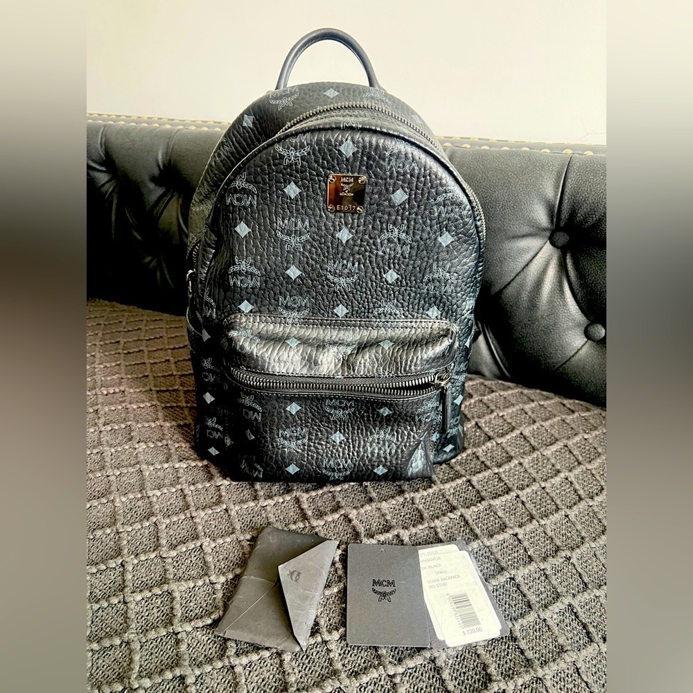 Authentic MCM black & grey small unisex backpack with tags. Good condition !